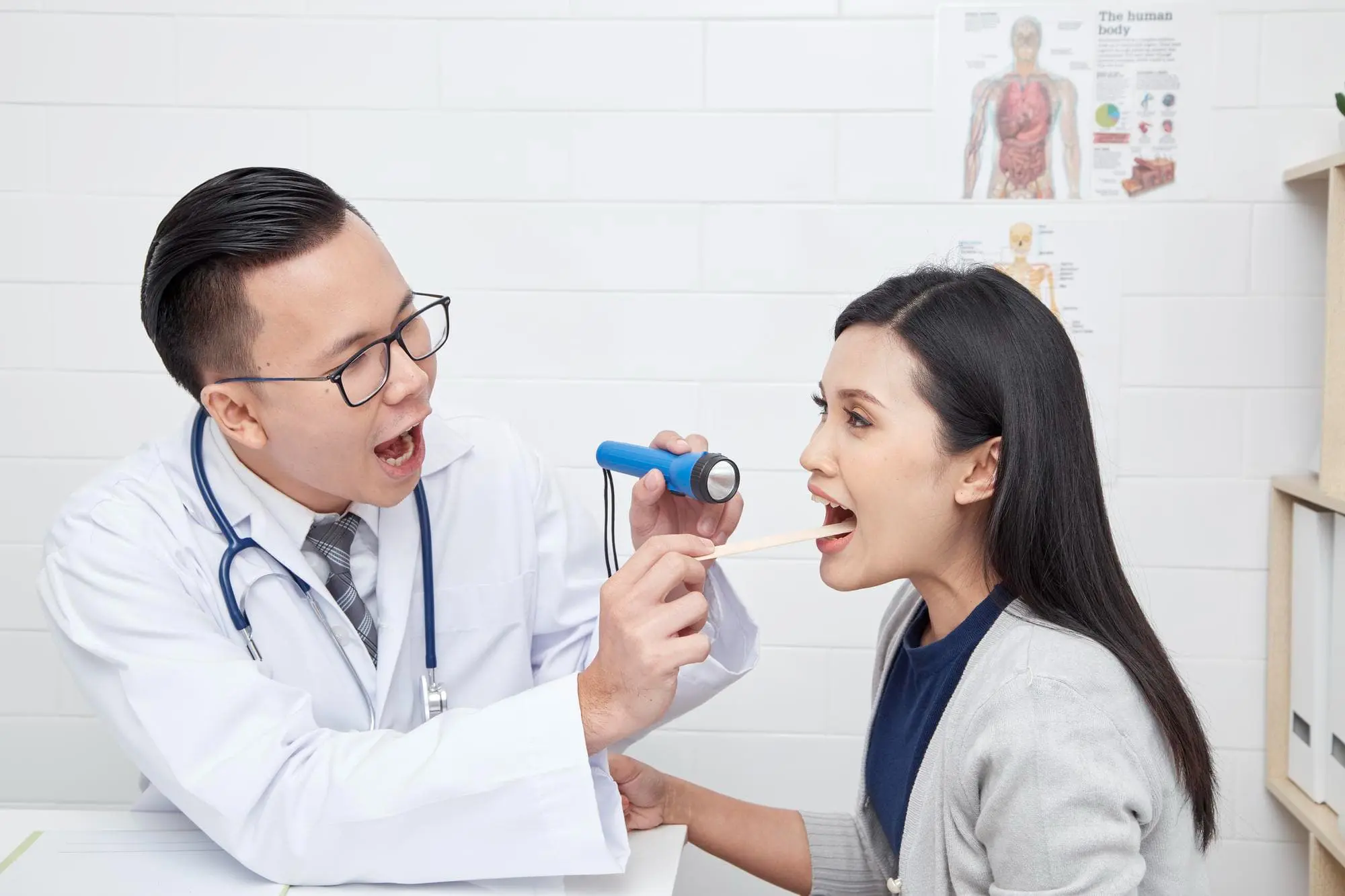 Orthodontist explaining tongue thrust treatment options to a woman during a consultation at Star Smiles Orthodontics and Pediatric Dentistry in Bloomingdale and Naperville, IL.