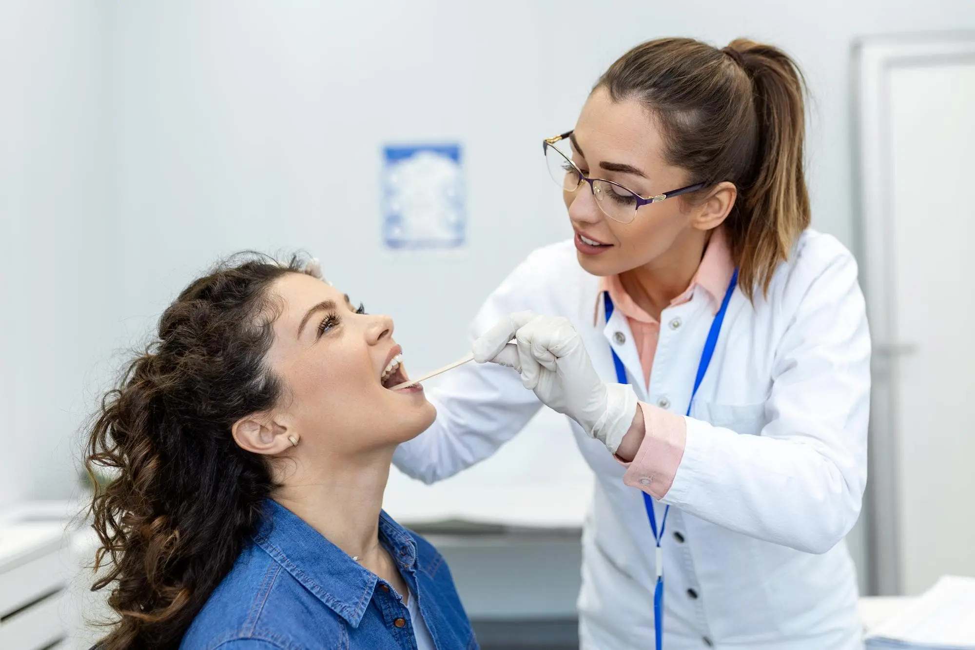 Young woman undergoing orthodontic treatment to correct tongue thrust issues in Bloomingdale and Naperville, IL.