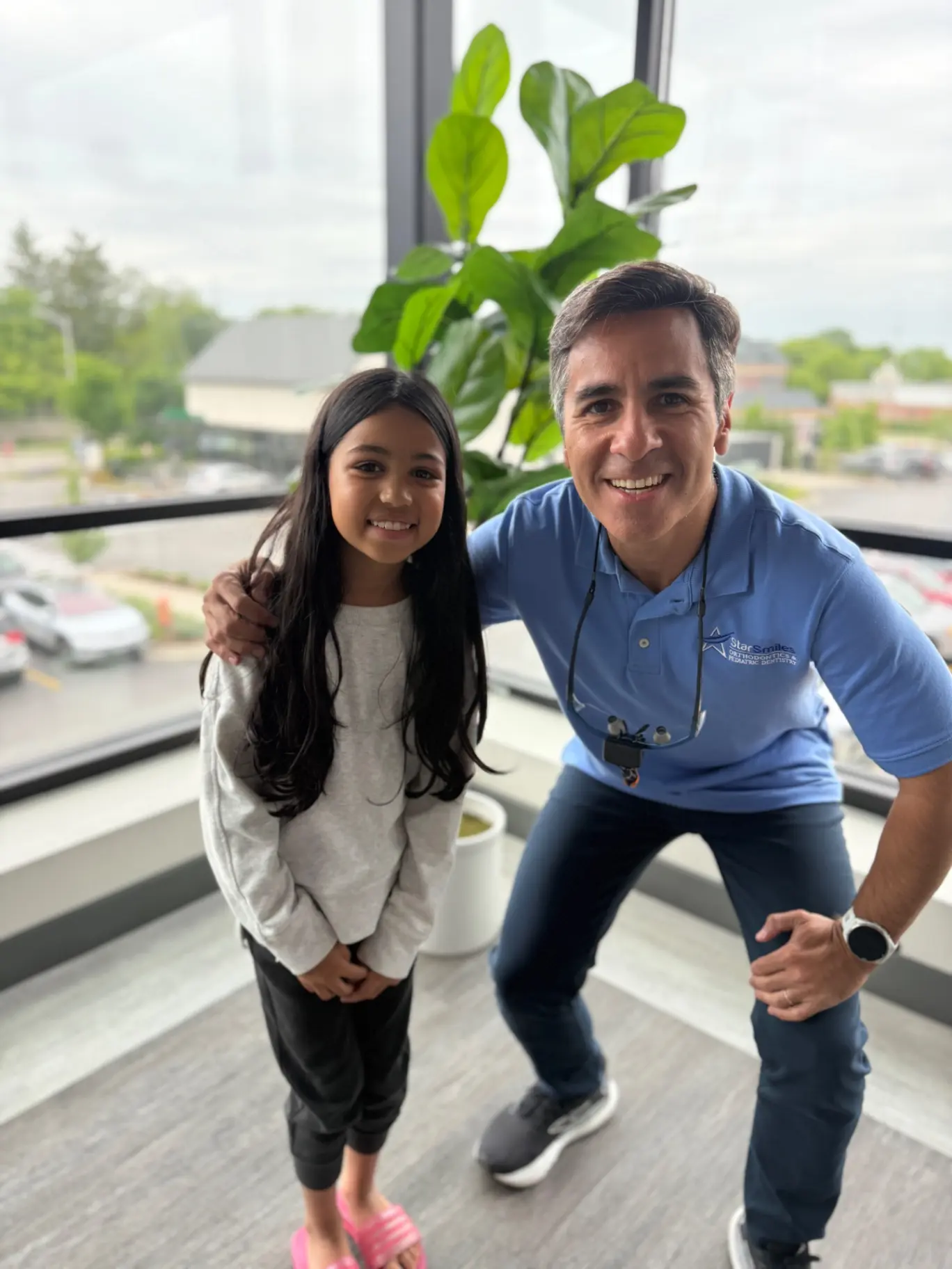 Dentist with children smile after get free orthodontic consultation at Star Smiles Orthodontics and Pediatric Dentistry in Bloomingdale and Naperville, IL.