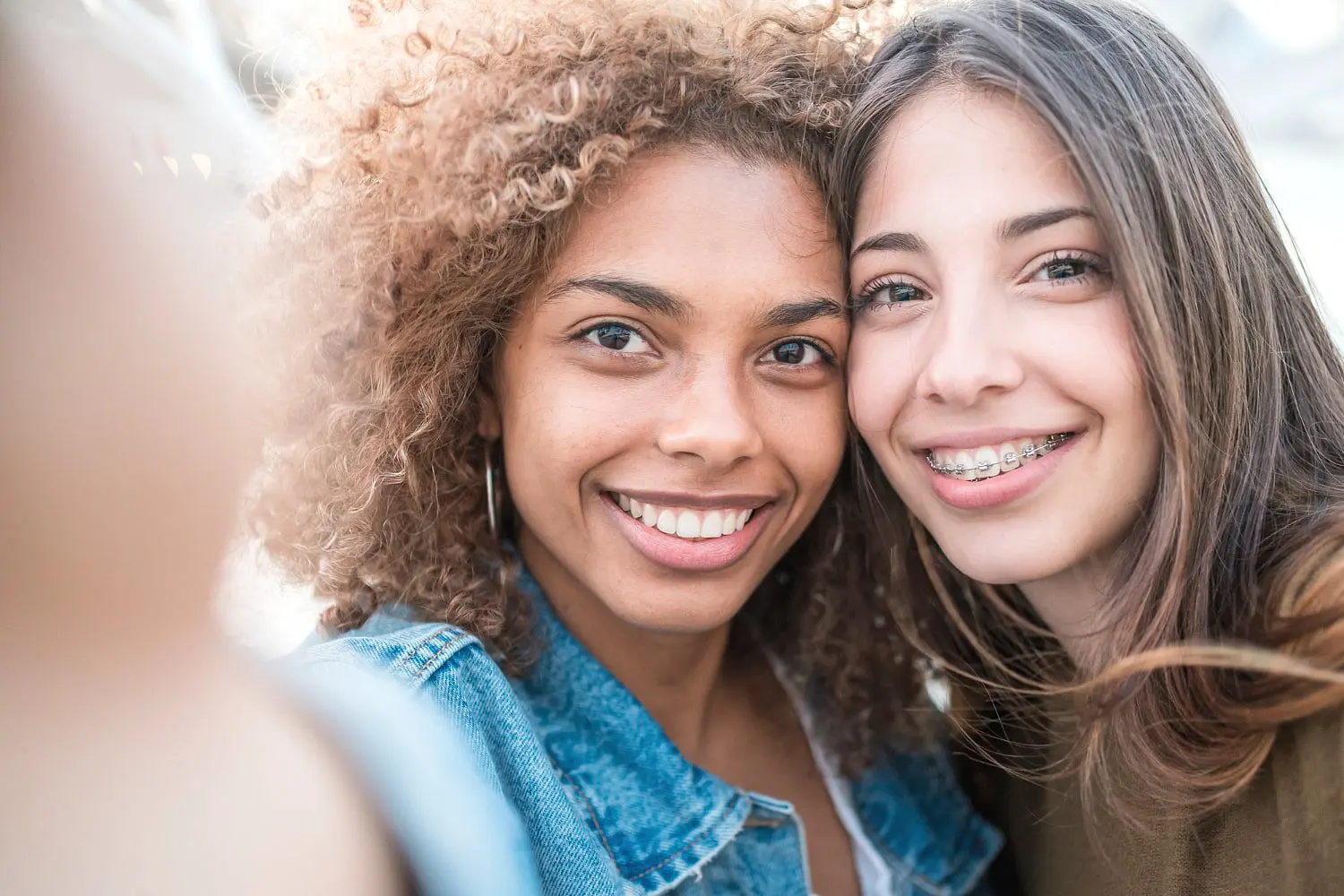 Two Woman taking selfie, second woman with braces from top-rated orthodontist from Star Smiles Orthodontics and Pediatric Dentistry in Naperville, IL.