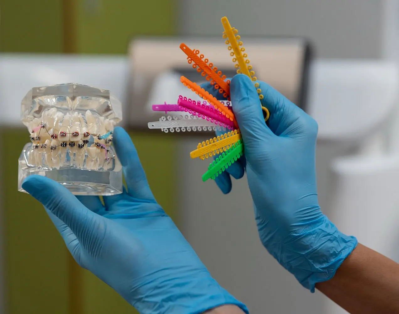 A dentist hold model metal braces, show superior strength of metal braces from Star Smiles Orthodontics and Pediatric Dentistry in Bloomingdale and Naperville, IL.