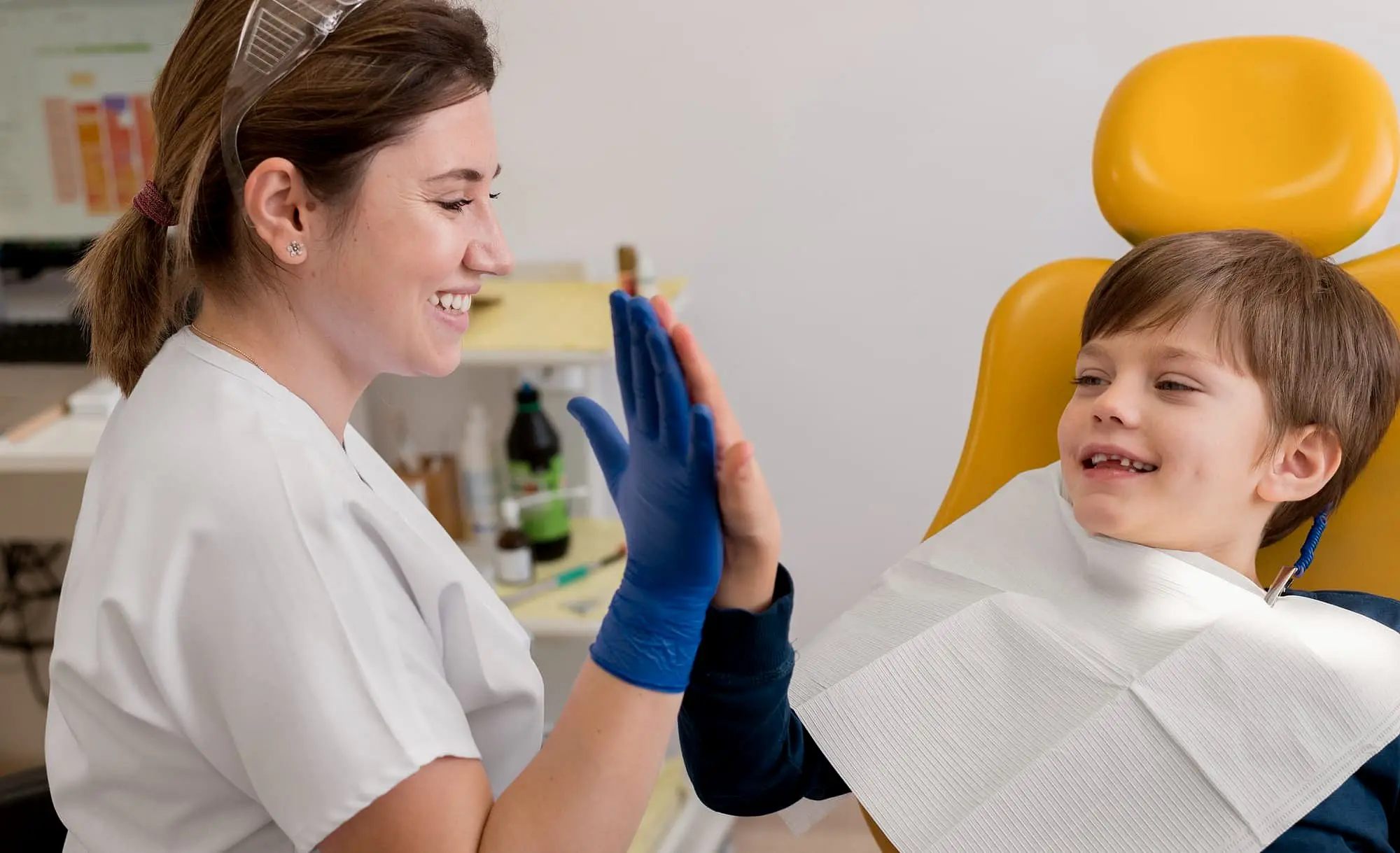 Child smiling in dental chair with Children’s Orthodontist for initial orthodontic evaluation at Star Smiles Orthodontics and Pediatric Dentistry in Bloomingdale and Naperville, IL.