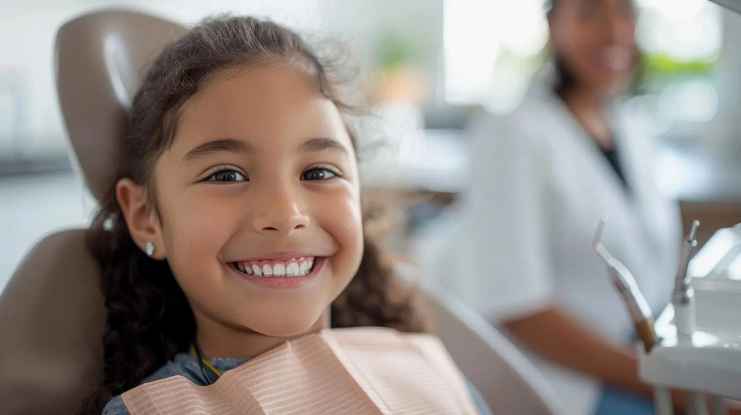 A smiling young person with long hair, show result affordable braces treatment by Star Smiles Orthodontics and Pediatric Dentistry in Bloomingdale and Naperville, IL.