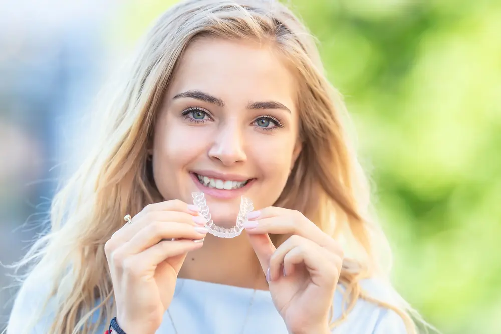 A woman ready to transform her smile with the clear aligners and get Invisalign free consultation at Star Smiles Orthodontics and Pediatric Dentistry in Naperville, IL.
