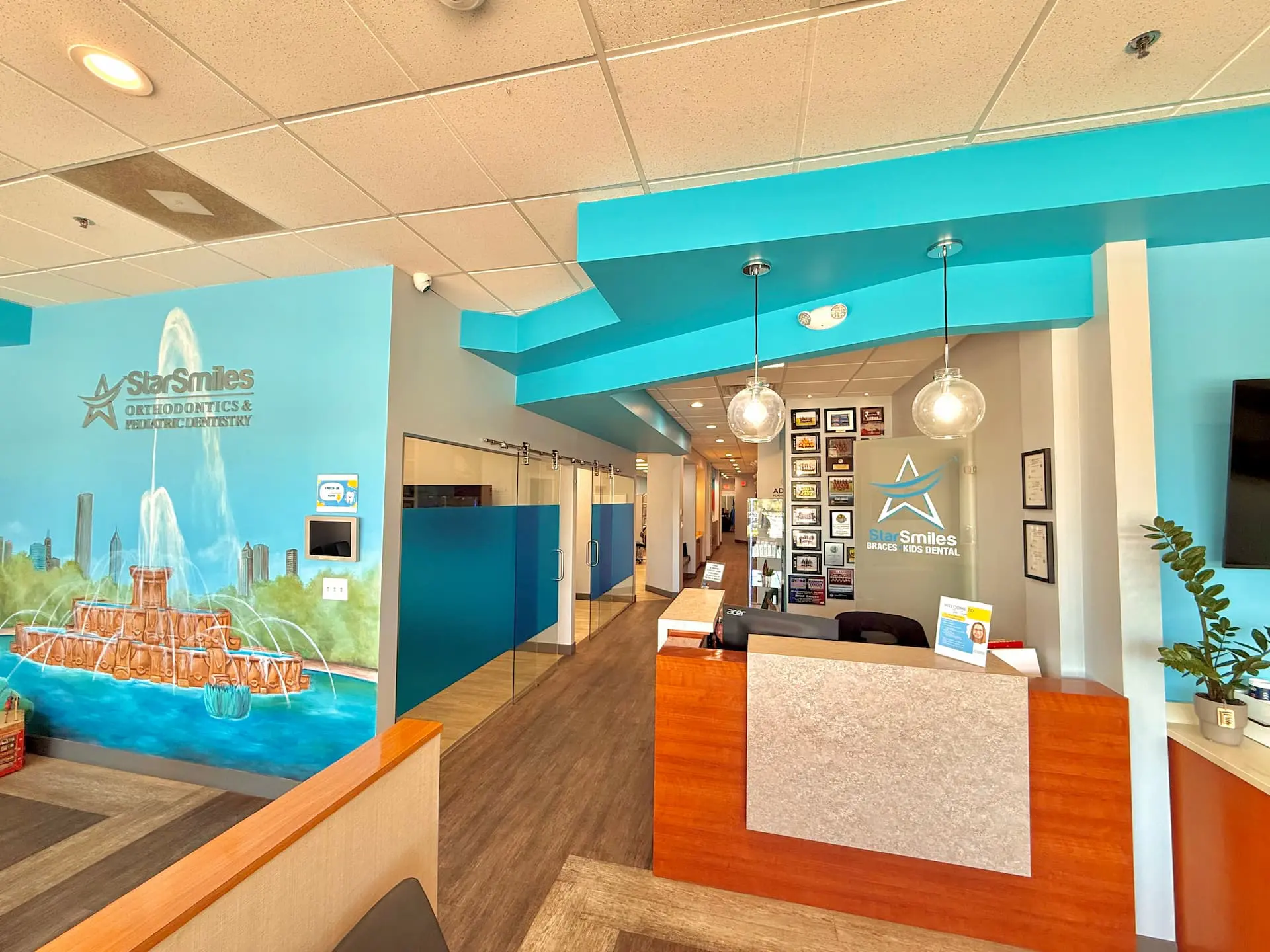 The reception area at Star Smiles Pediatric Dentistry in Bloomingdale or Naperville, IL features blue accents, seating, dental info displays, and educational materials about orthodontic issues such as Underbite.